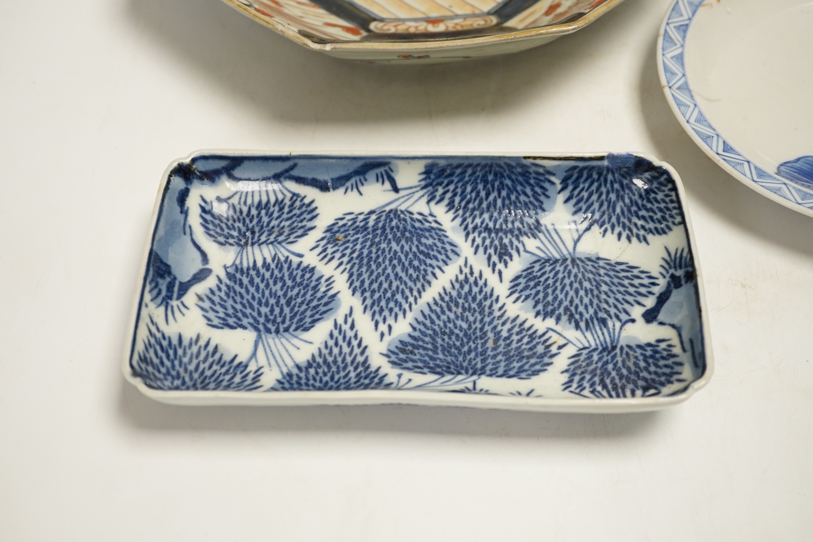 A late 17th/early 18th century Japanese Arita dish (a.f) and two other Arita pieces, largest 27cm